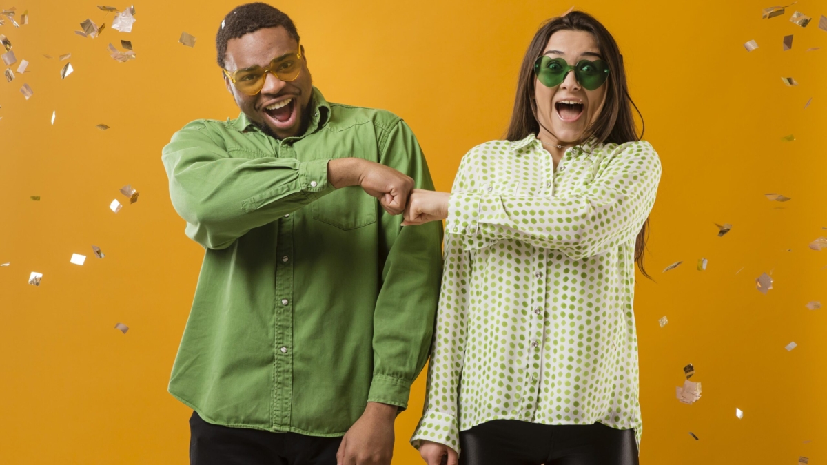 couple-party-having-fun-holding-balloons